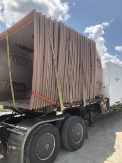 Hay Bonnets stacked on delivery truck